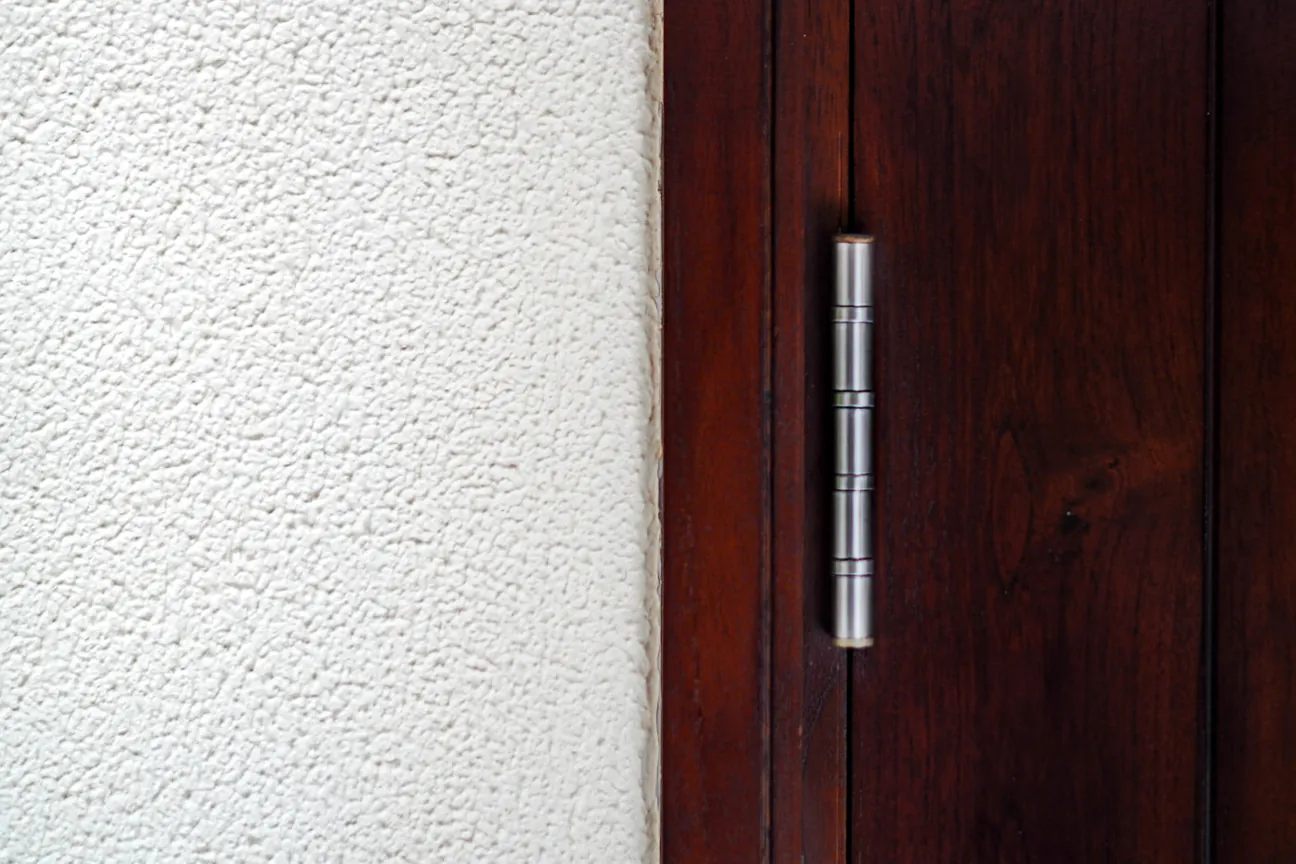 A door hinge being fastened